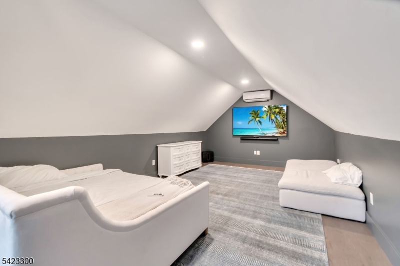 16 East Greenbrook Road North Caldwell, NJ 07006 - Photo 43 of 45 a bedroom with a bed and a couch