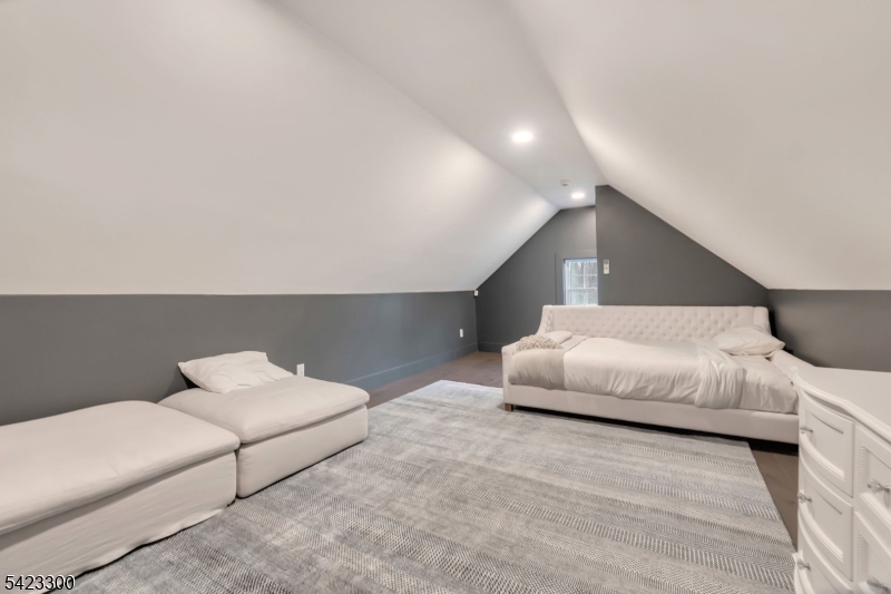 16 East Greenbrook Road North Caldwell, NJ 07006 - Photo 44 of 45 a bedroom with a bed and a couch