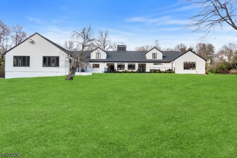 16 East Greenbrook Road North Caldwell, NJ 07006 - Photo 45 of 45 a front view of a house with a garden
