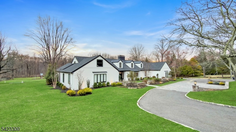 16 East Greenbrook Road North Caldwell, NJ 07006 - Photo 6 of 45 a front view of a house with garden