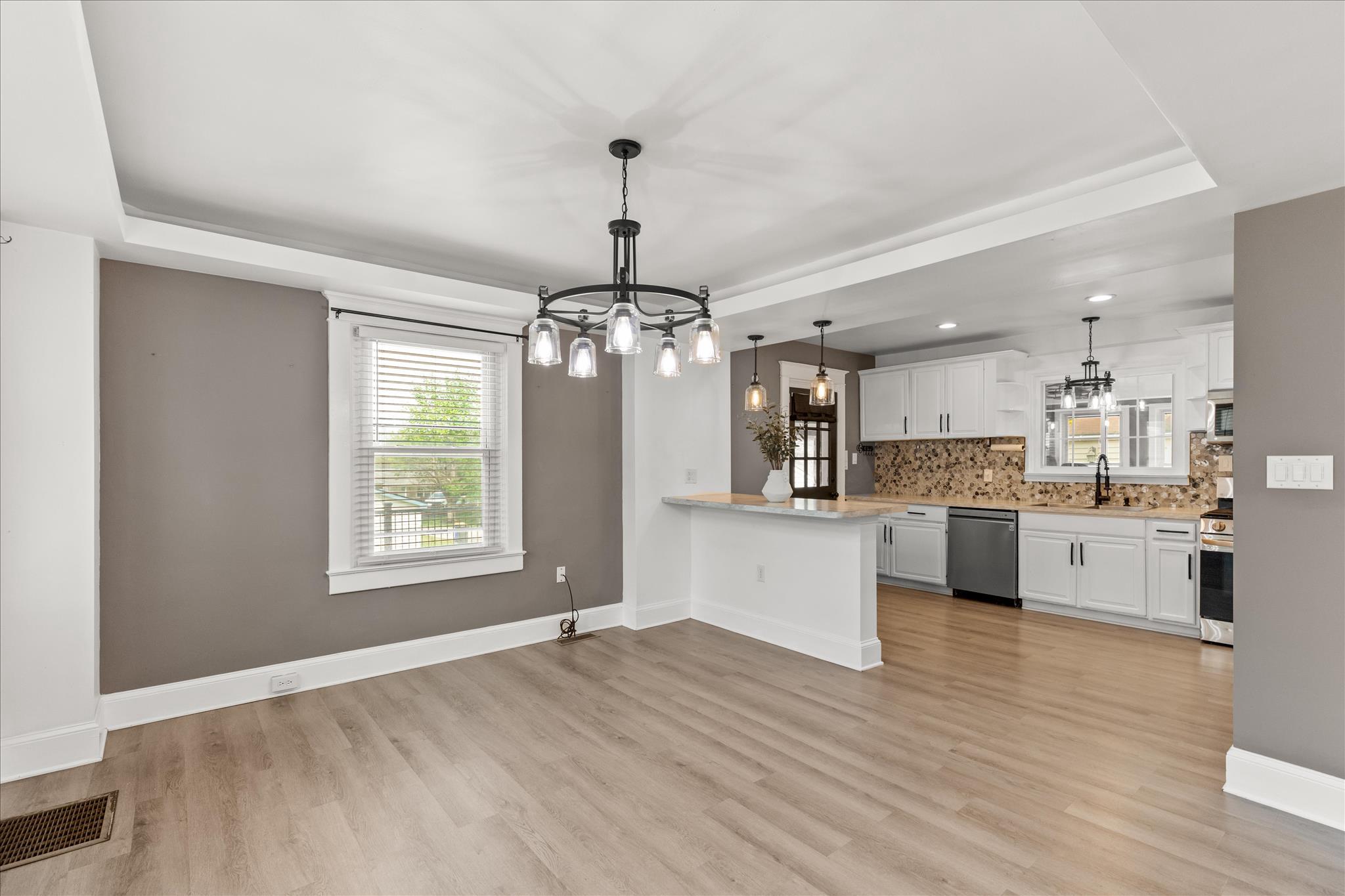 310 Hanover Road York, PA 17408 - Photo 13 of 56 a large kitchen with kitchen island a counter top space a sink stainless steel appliances and cabinets