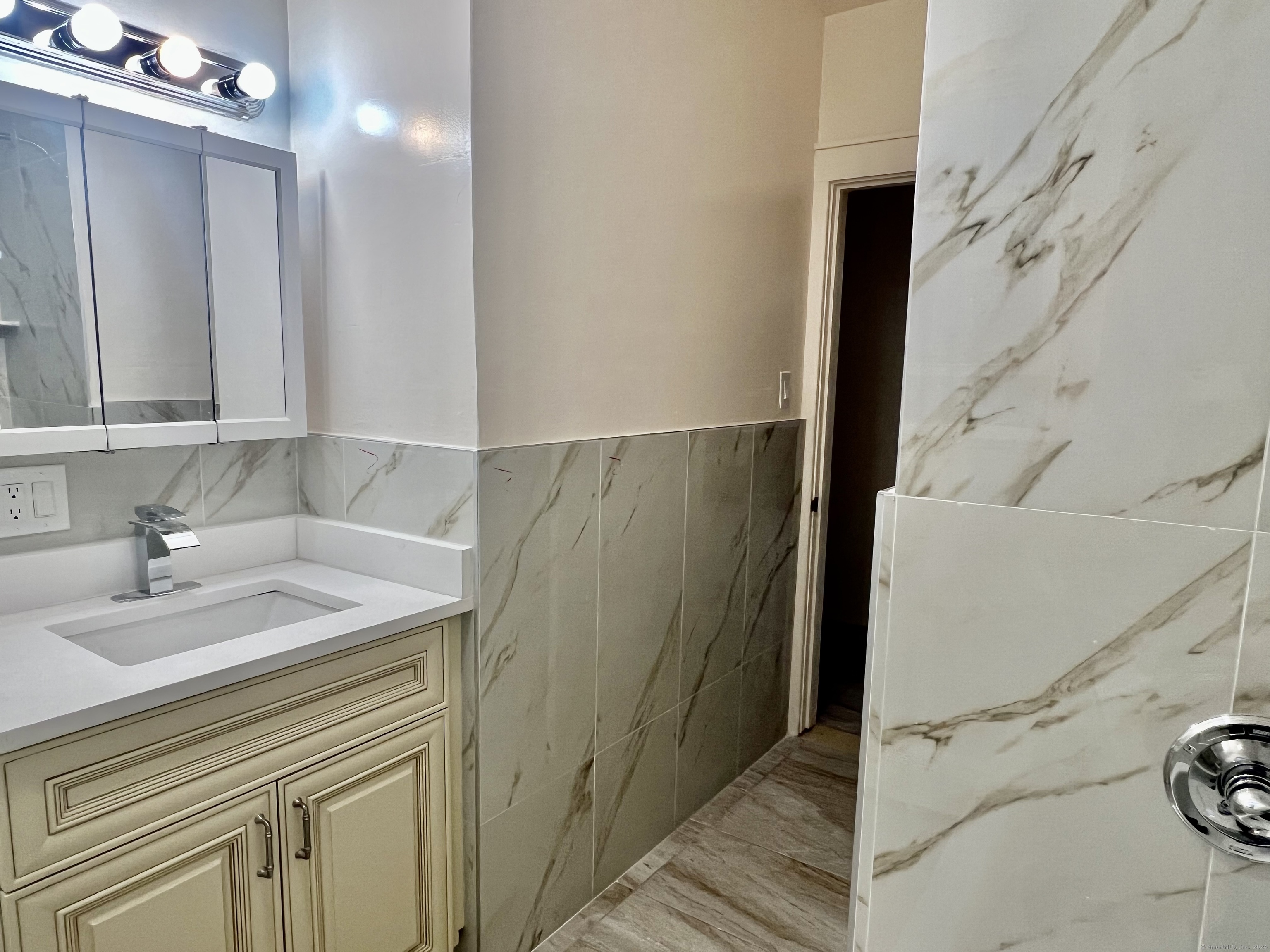 38 Wilson Street Stamford, CT 06902 - Photo 17 of 30 a bathroom with a sink and a mirror