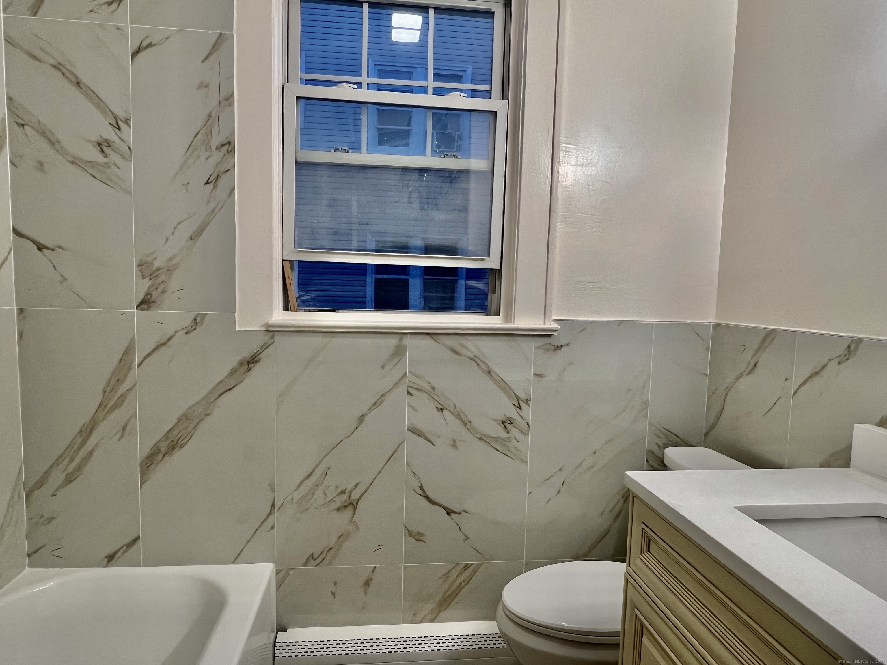 38 Wilson Street Stamford, CT 06902 - Photo 18 of 30 a bathroom with a toilet and a sink