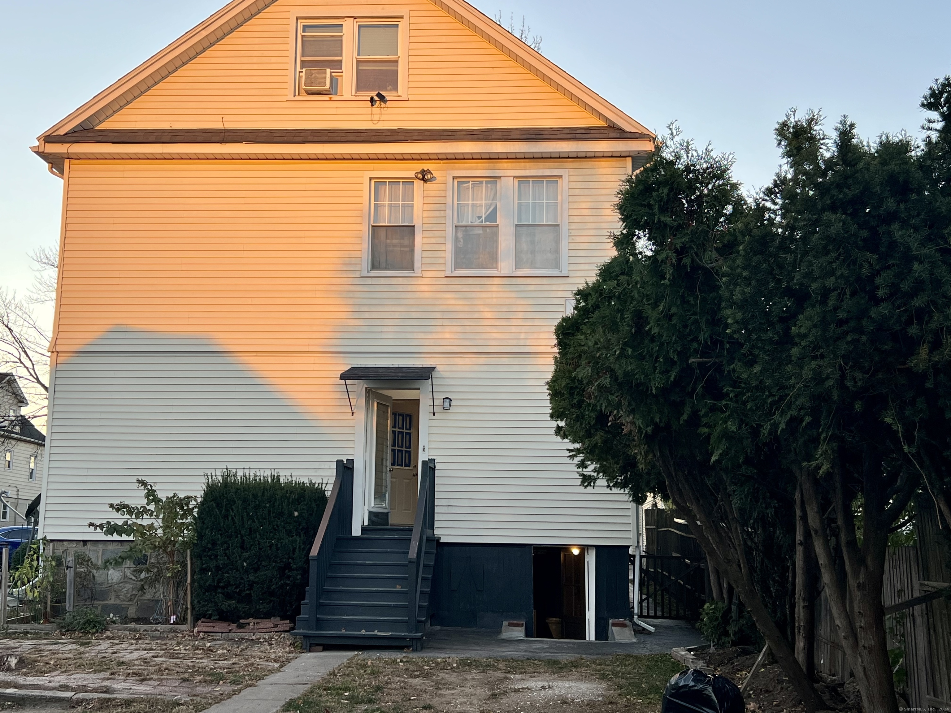 38 Wilson Street Stamford, CT 06902 - Photo 2 of 30 a front view of a house with stairs