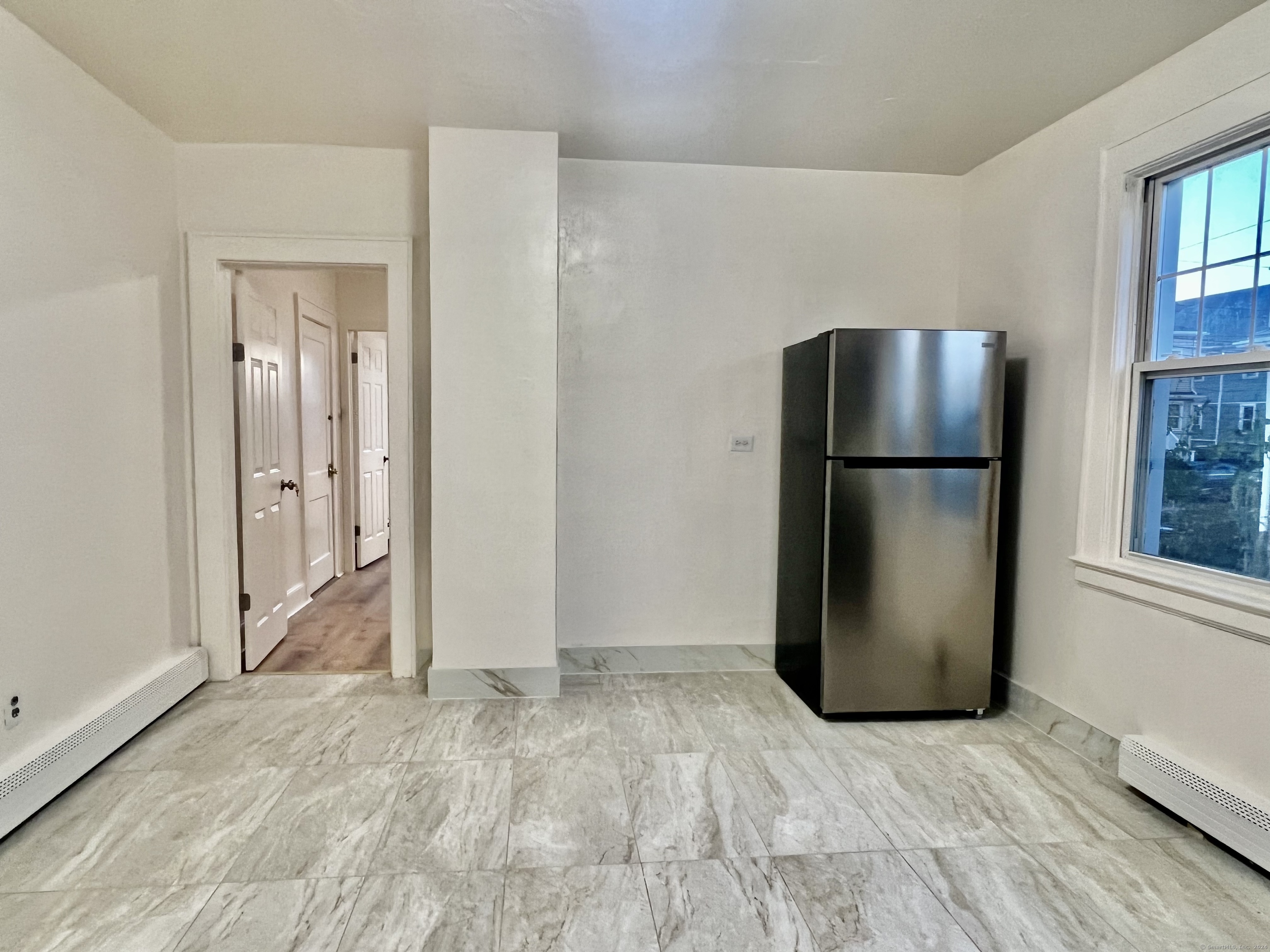 38 Wilson Street Stamford, CT 06902 - Photo 3 of 30 a view of kitchen with furniture and refrigerator