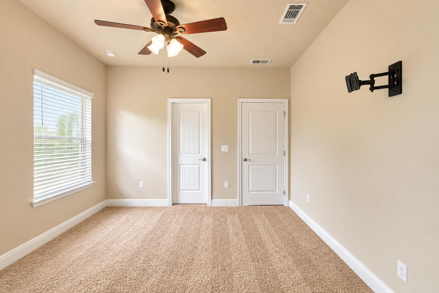 3445 Brownstone Road Crestview, FL 32539 - Photo 14 of 21 Empty Beige Room with Ceiling Fan and Do