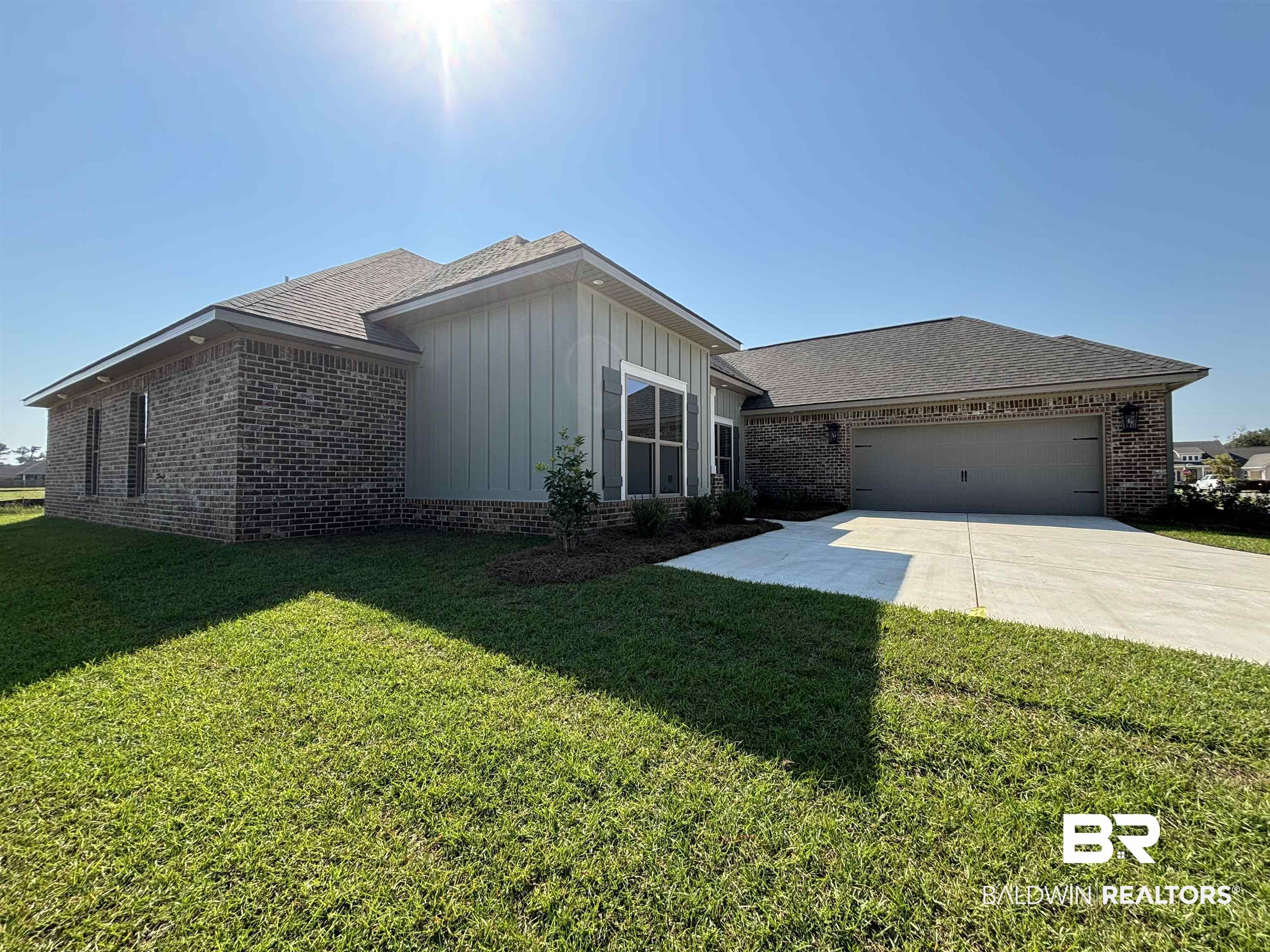 388 Garrison Boulevard Fairhope, AL 36532 - Photo 15 of 34 View of front of house featuring a front yard and a garage