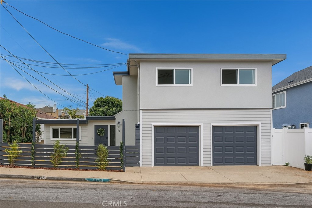 a front view of a house with a garage