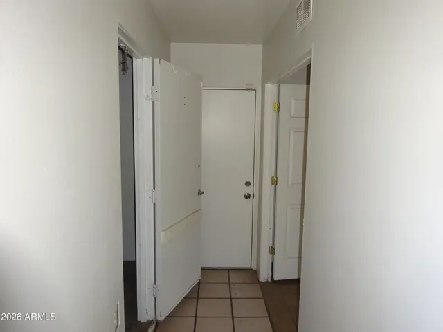 a bathroom with a shower and mirror