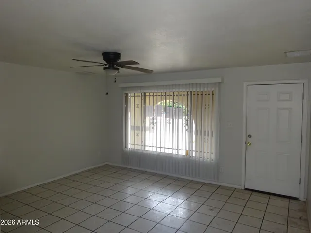 a view of an empty room and window