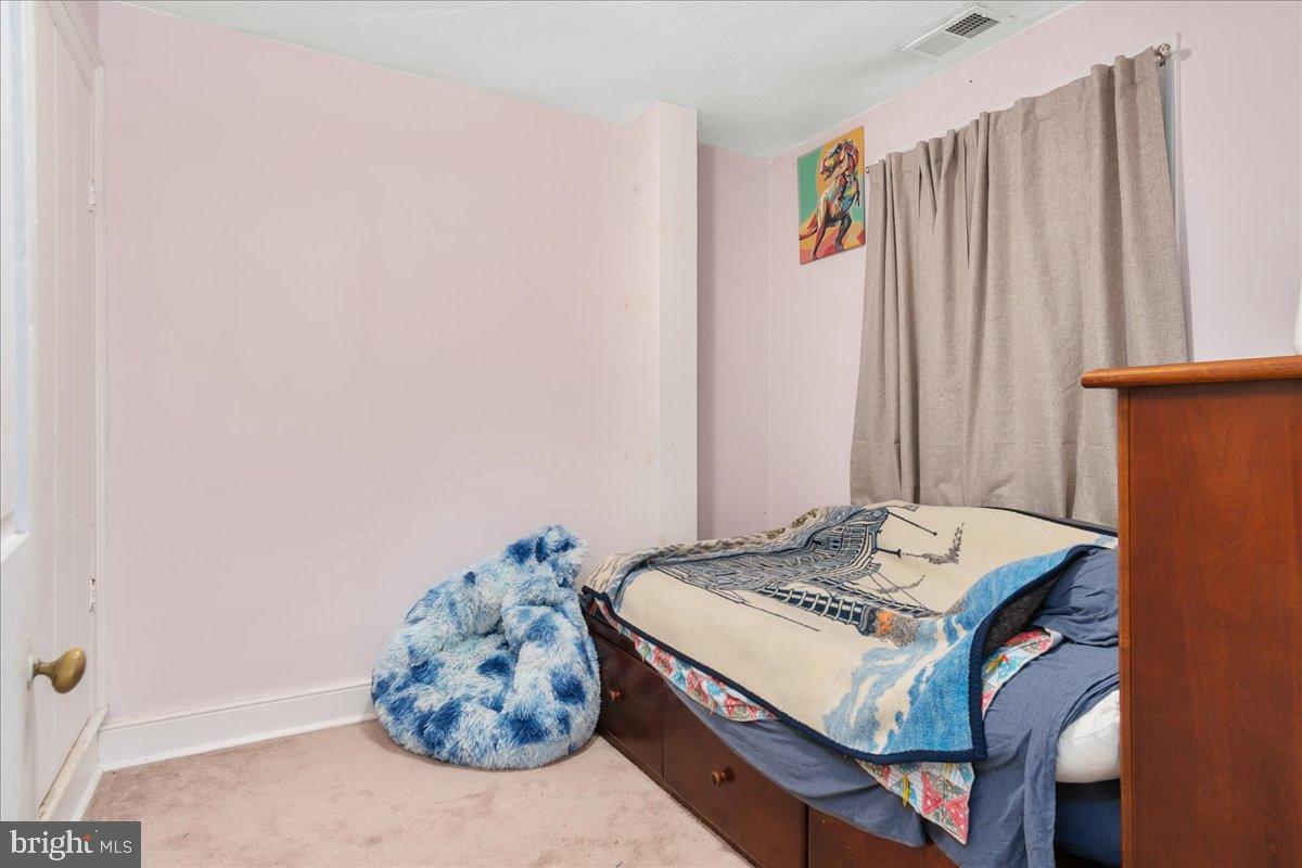 4402 Main Street Rohrersville, MD 21779 - Photo 13 of 31 Cozy pastel-hued bedroom retreat.