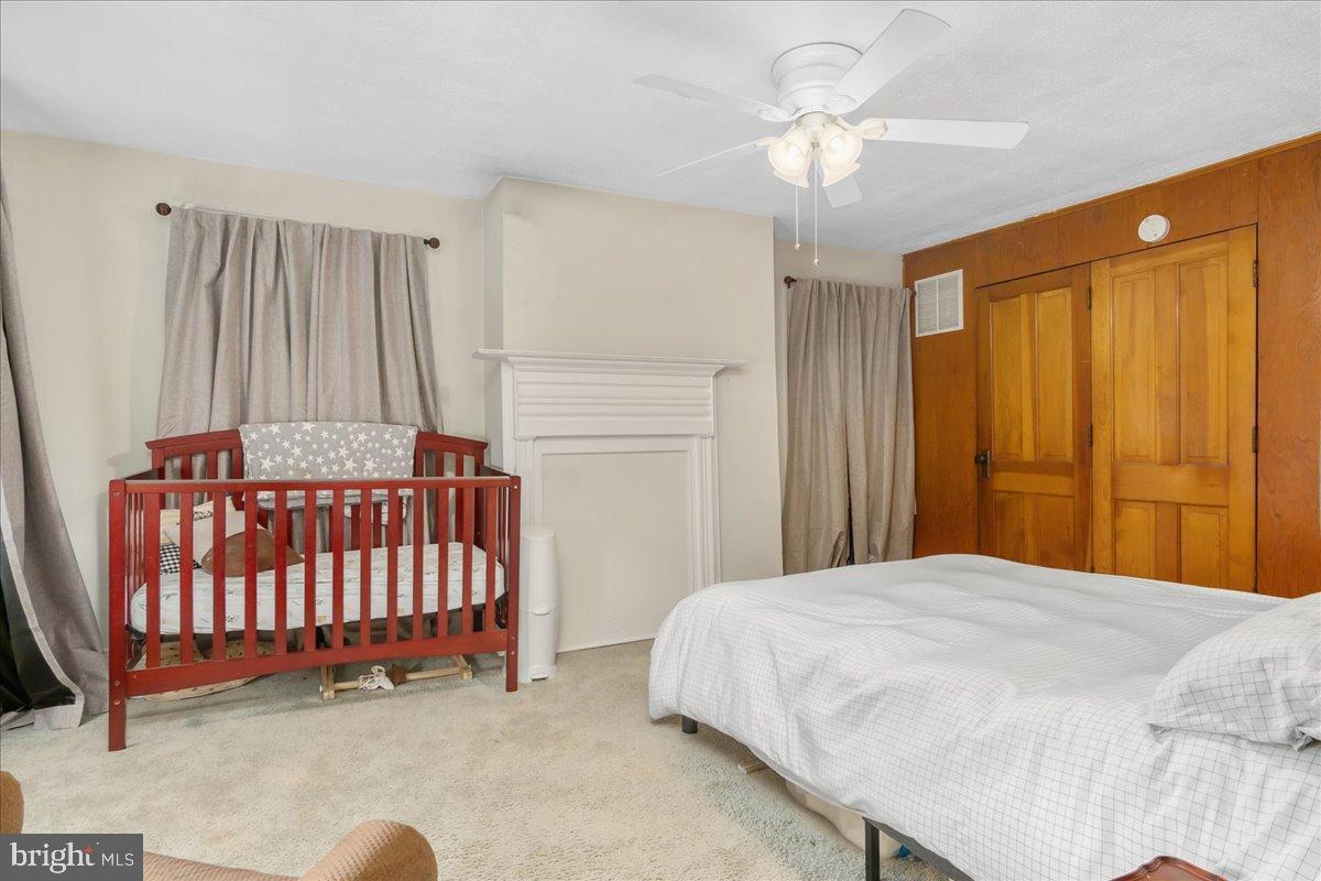 4402 Main Street Rohrersville, MD 21779 - Photo 14 of 31 Cozy nursery with warm wooden accents.