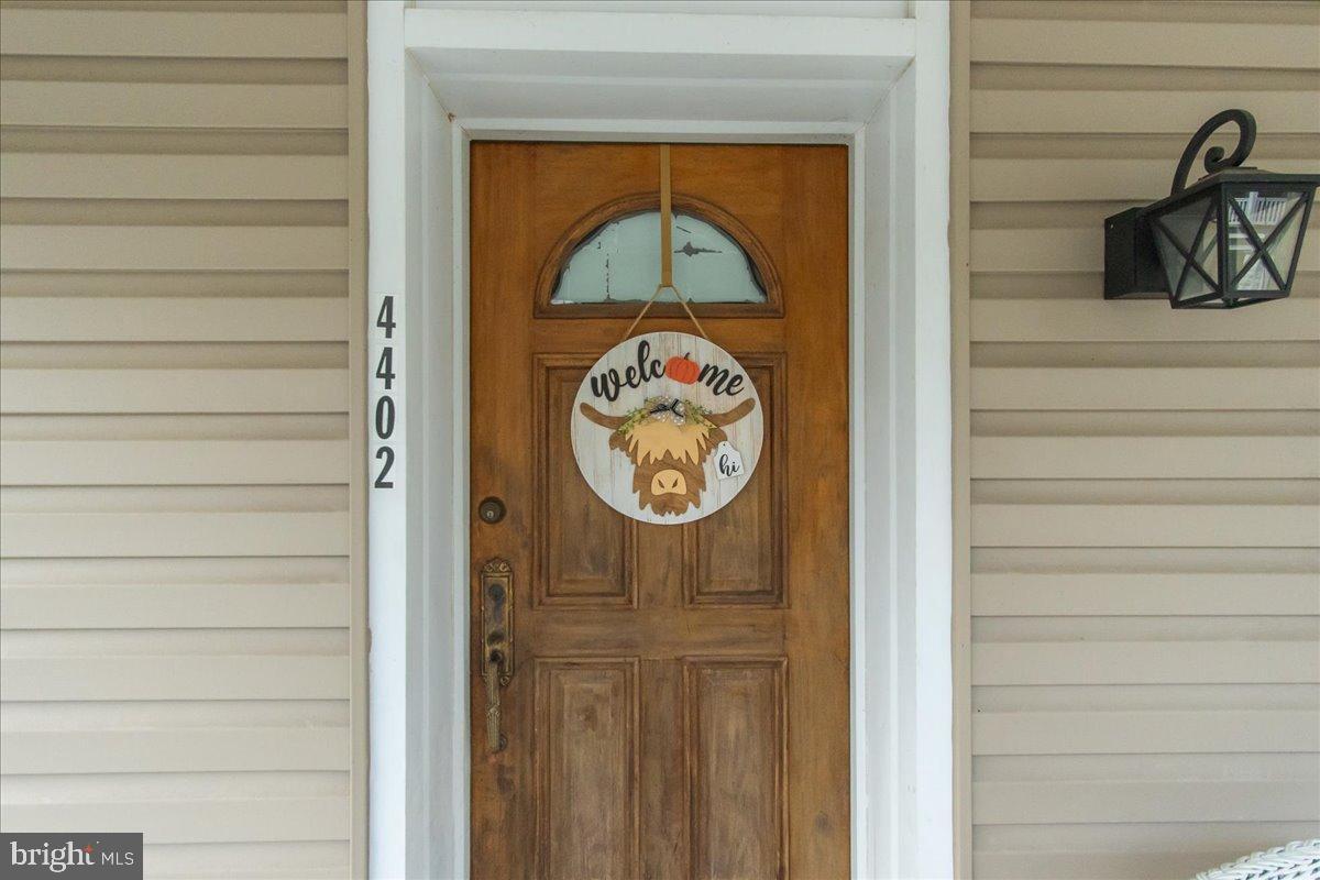 4402 Main Street Rohrersville, MD 21779 - Photo 5 of 31 Charming entrance with a warm welcome sign.