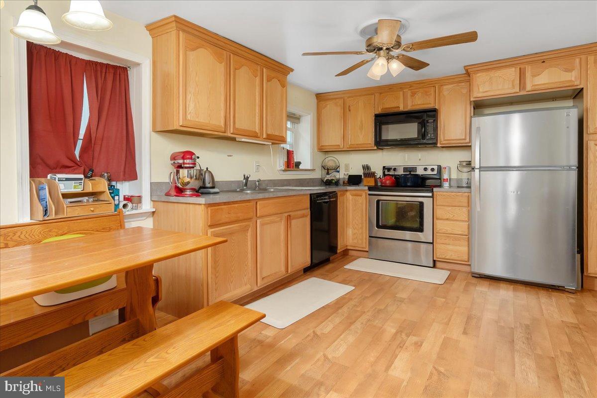 4402 Main Street Rohrersville, MD 21779 - Photo 9 of 31 Warm and inviting kitchen with wooden accents.