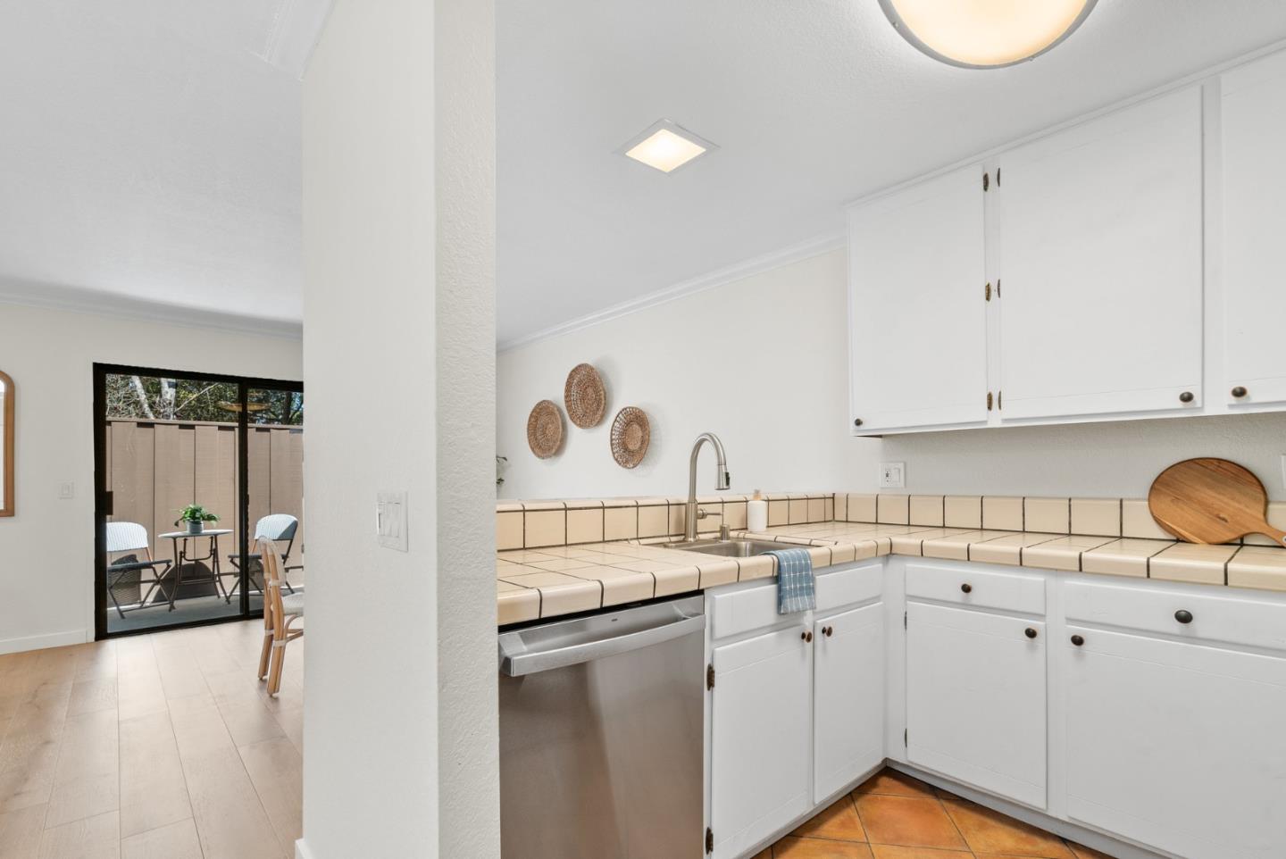 6101 Sheraton Place Aptos, CA 95003 - Photo 20 of 47 a kitchen with white cabinets and sink