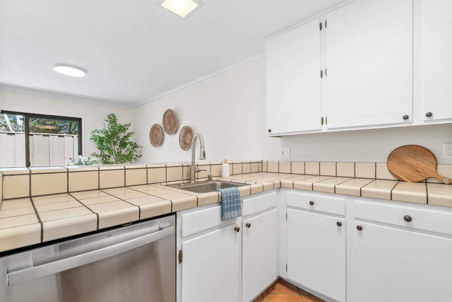6101 Sheraton Place Aptos, CA 95003 - Photo 21 of 47 a kitchen with appliances cabinets and a counter top