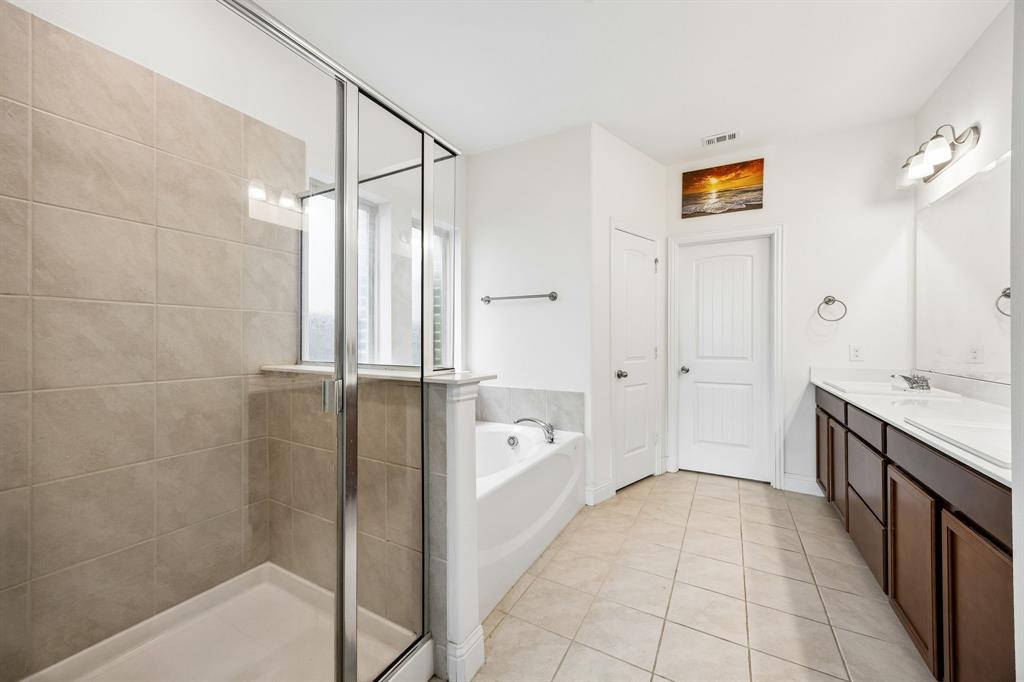 11732 Wulstone Road Fort Worth, TX 76052 - Photo 12 of 34 Walk-in shower with clear glass enclosure and light-toned tile surround
