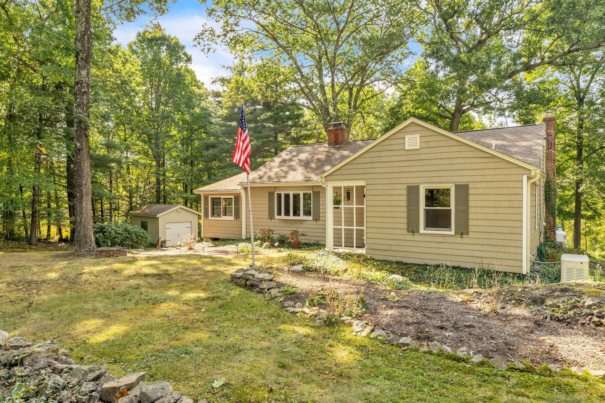 Welcome to 123 Duncaster Rd where stone walls adorn the exterior of the home.