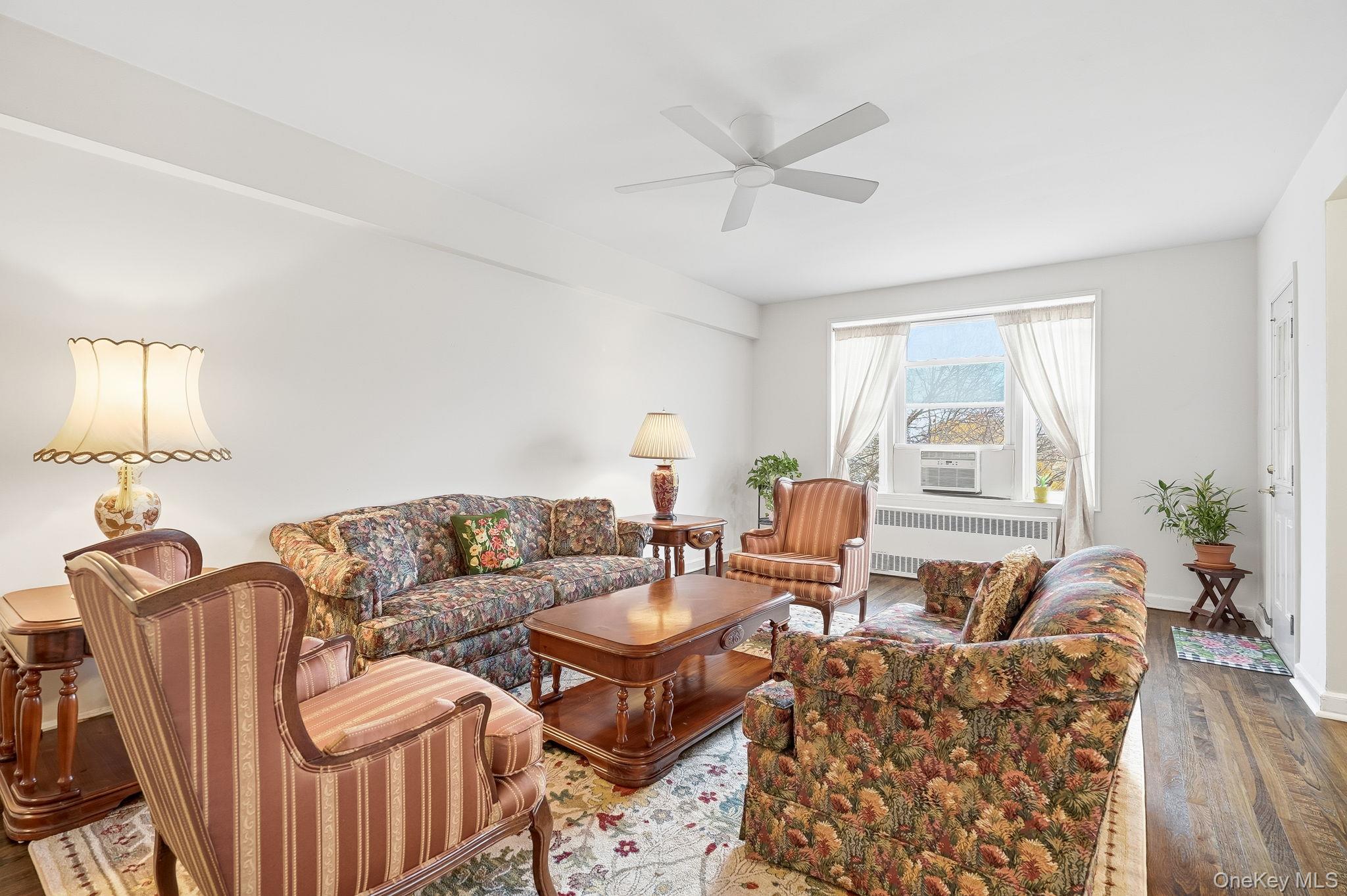 2 Overlook Road, Unit 3C3 White Plains, NY 10605 - Photo 11 of 36 a living room with furniture a window and a wooden floor