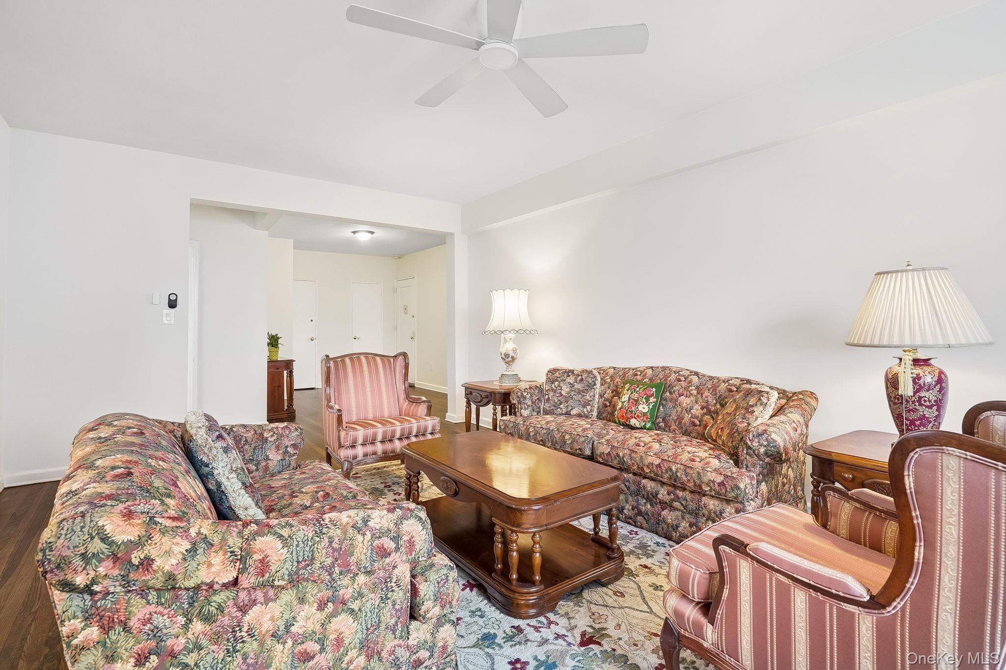 2 Overlook Road, Unit 3C3 White Plains, NY 10605 - Photo 12 of 36 a living room with furniture and a lamp