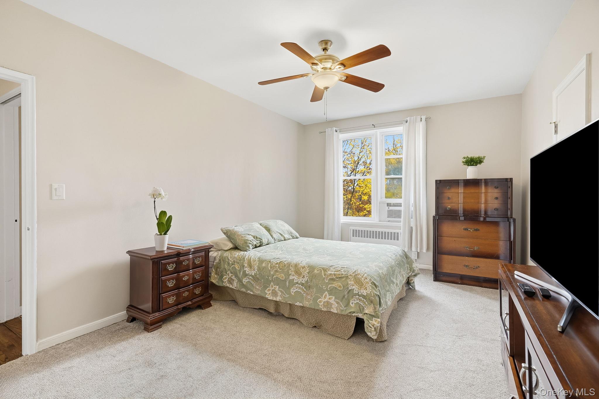 2 Overlook Road, Unit 3C3 White Plains, NY 10605 - Photo 20 of 36 a bedroom with a bed and a flat screen tv