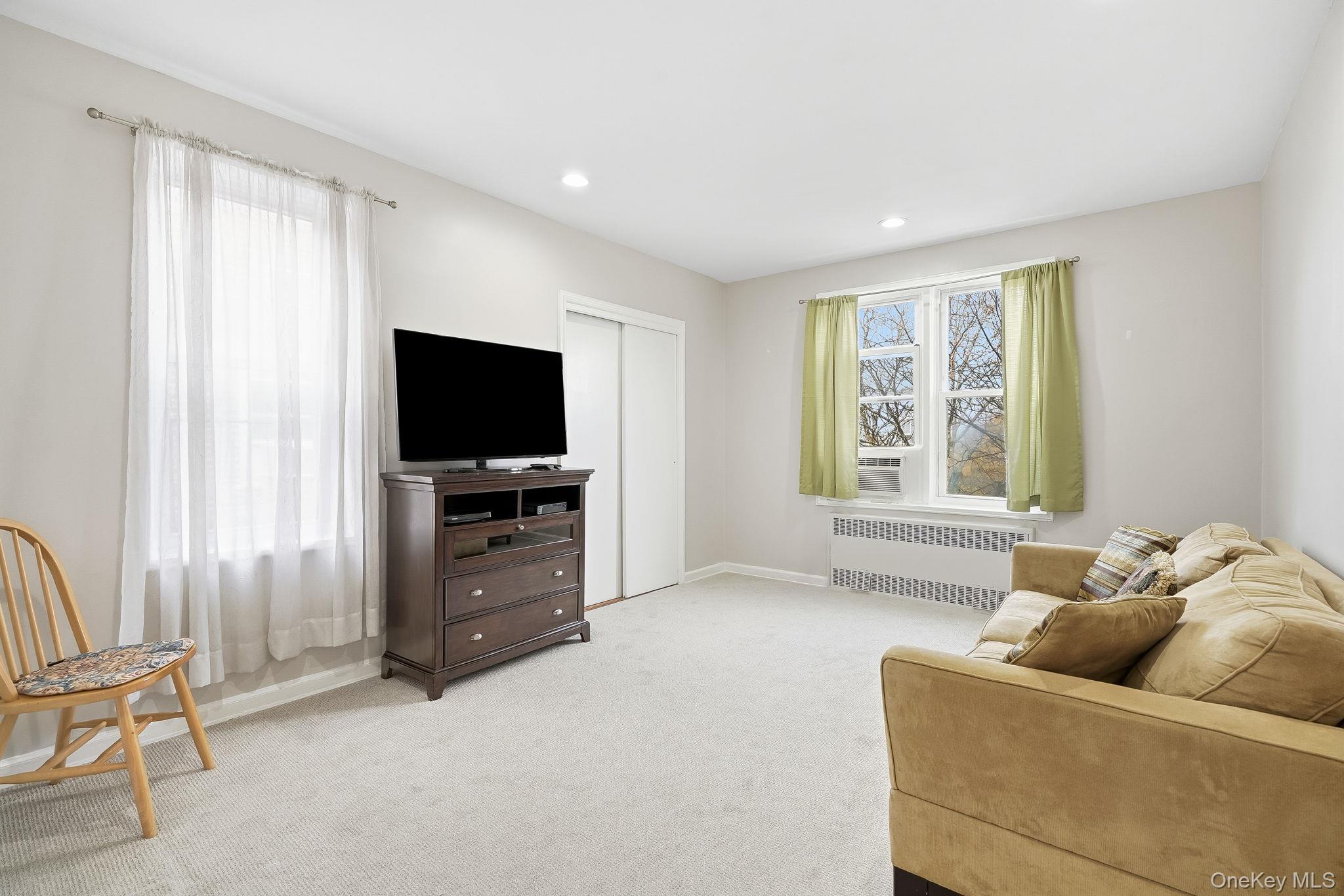 2 Overlook Road, Unit 3C3 White Plains, NY 10605 - Photo 23 of 36 a living room with furniture and a flat screen tv