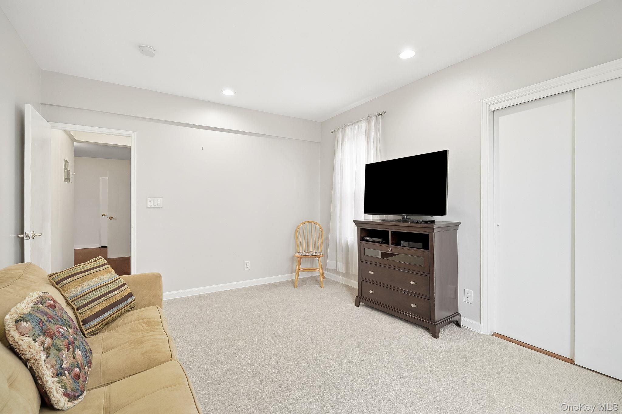 2 Overlook Road, Unit 3C3 White Plains, NY 10605 - Photo 24 of 36 a living room with furniture and a flat screen tv