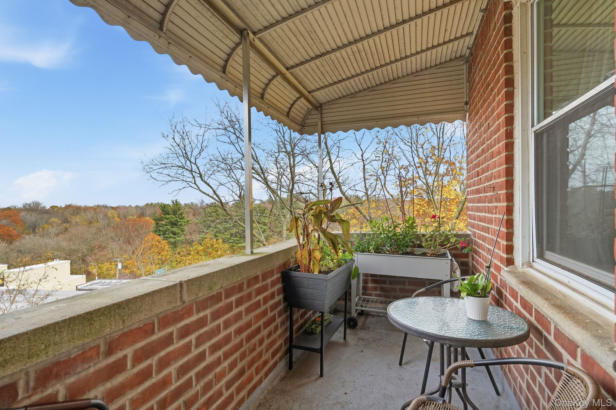 2 Overlook Road, Unit 3C3 White Plains, NY 10605 - Photo 26 of 36 a outdoor living space with furniture and a potted plant