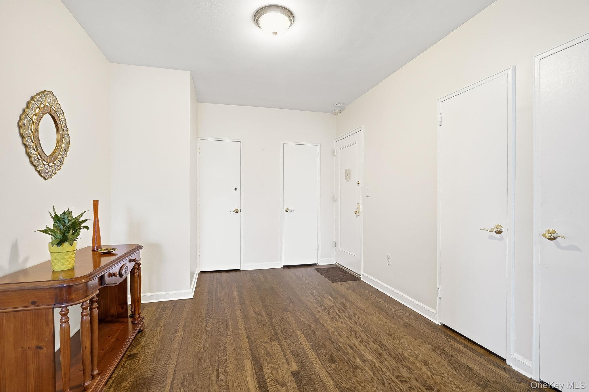 2 Overlook Road, Unit 3C3 White Plains, NY 10605 - Photo 9 of 36 a view of a room with wooden floor and a potted plant