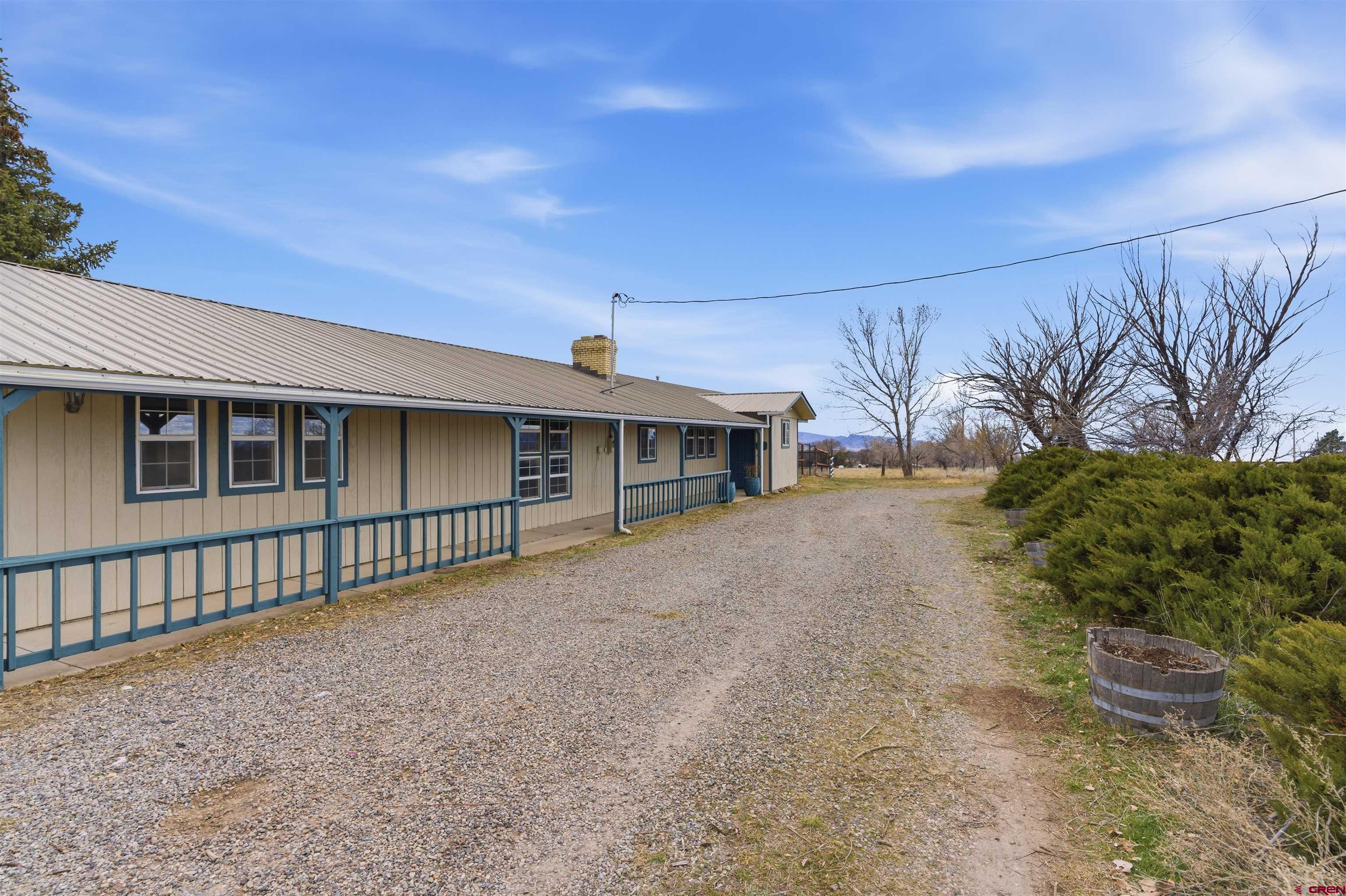 16216 2600th Road Cedaredge, CO 81413 - Photo 36 of 45 a front view of a house with a yard
