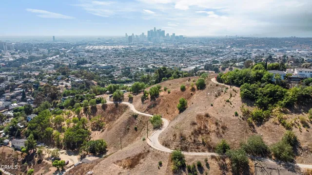 an aerial view of a house with a yard and garden