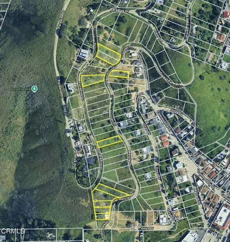 a aerial view of a house with a yard and garden