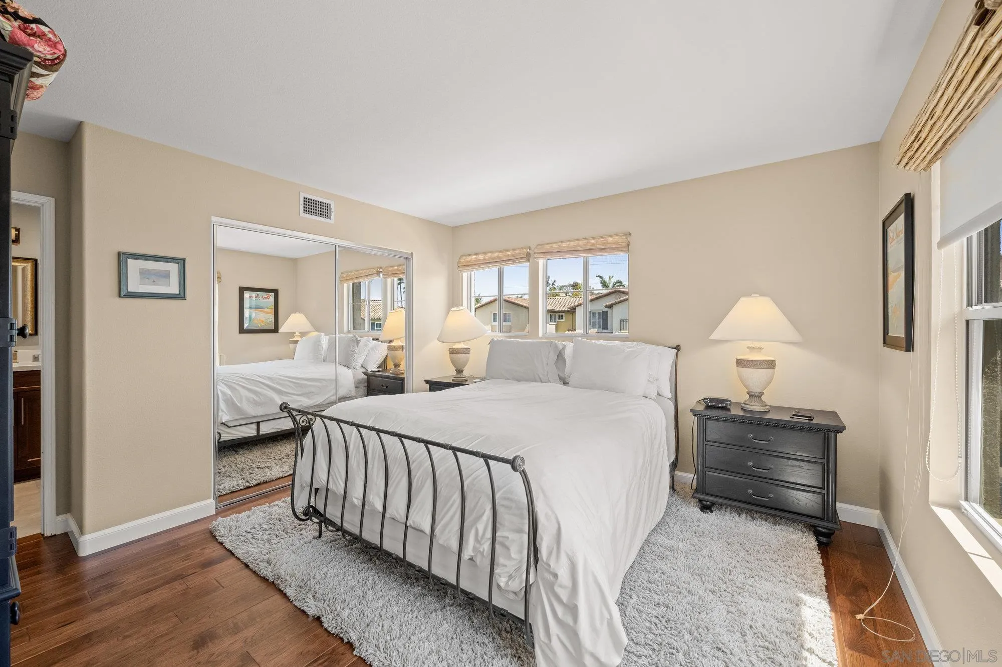 6845 Adolphia Drive Carlsbad, CA 92011 - Photo 14 of 33 a bedroom with a bed and a lamp