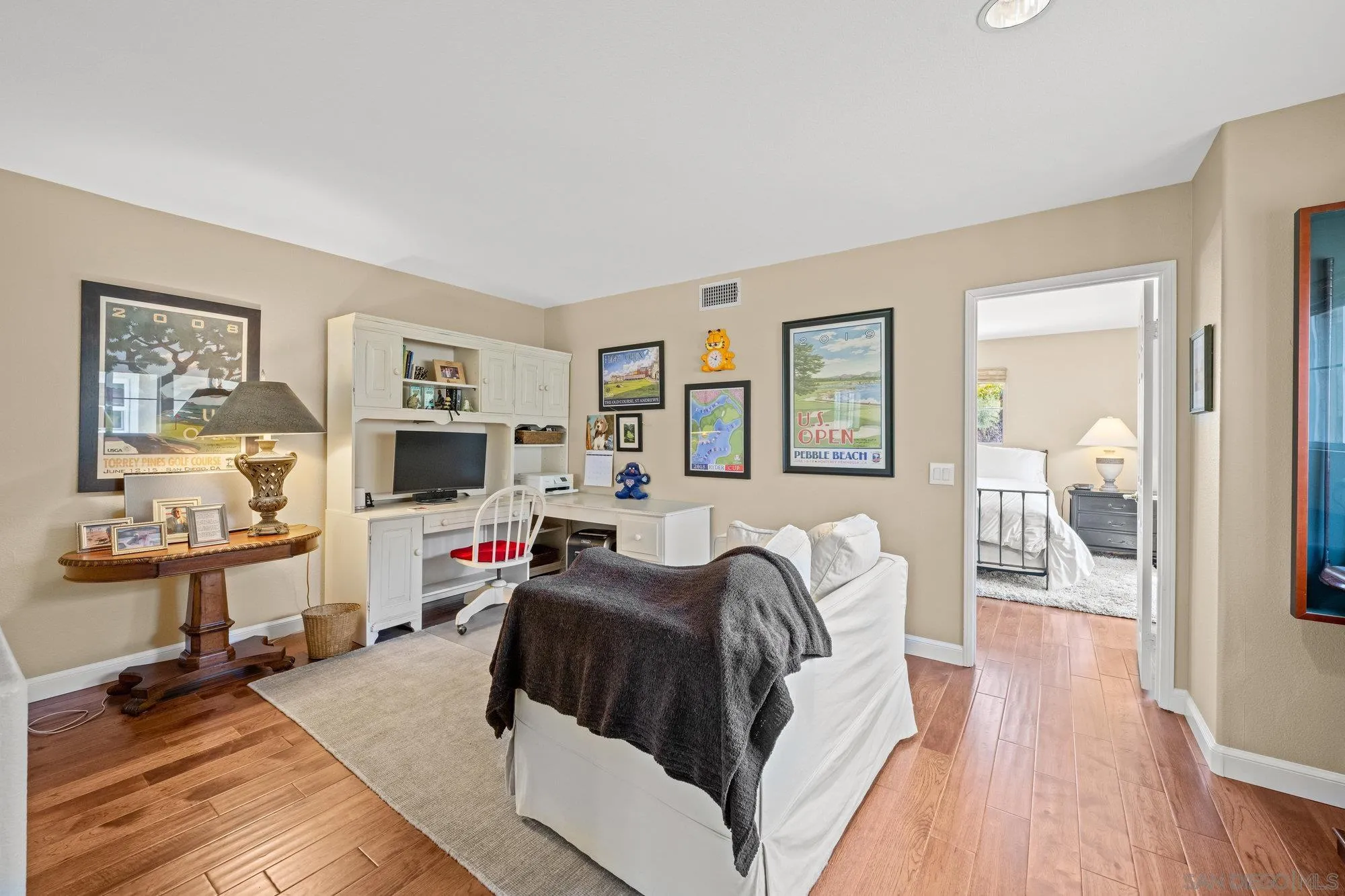 6845 Adolphia Drive Carlsbad, CA 92011 - Photo 15 of 33 a living room with furniture and a flat screen tv