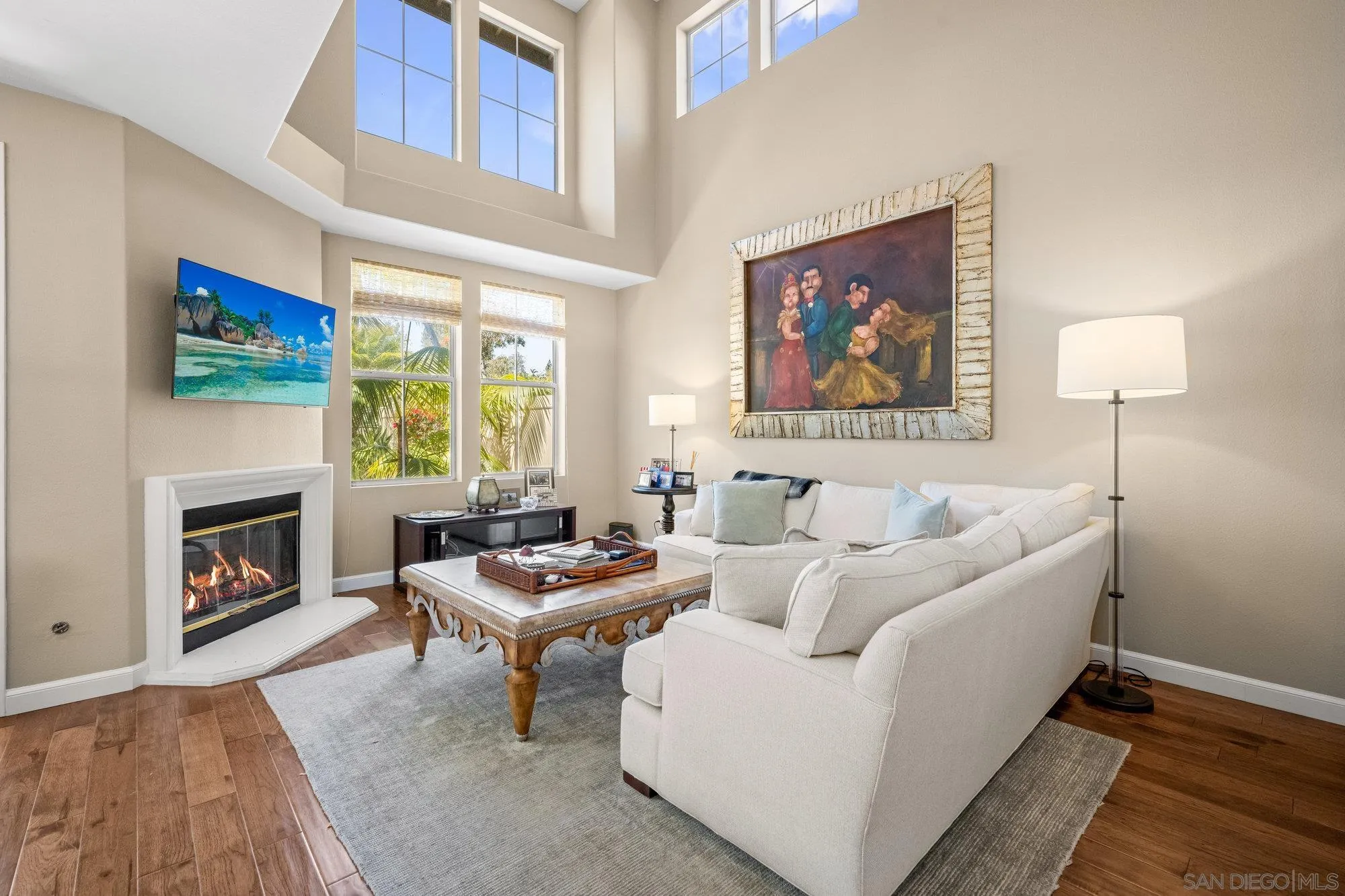 6845 Adolphia Drive Carlsbad, CA 92011 - Photo 3 of 33 a living room with furniture a fireplace and a flat screen tv