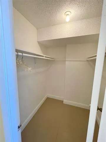 a view of workspace with furniture and ceiling fan