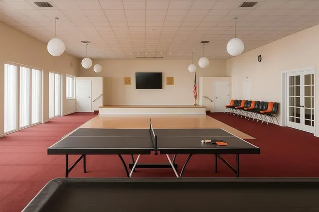 a view of a porch with a table and chairs