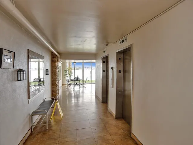 a view of a park with large trees