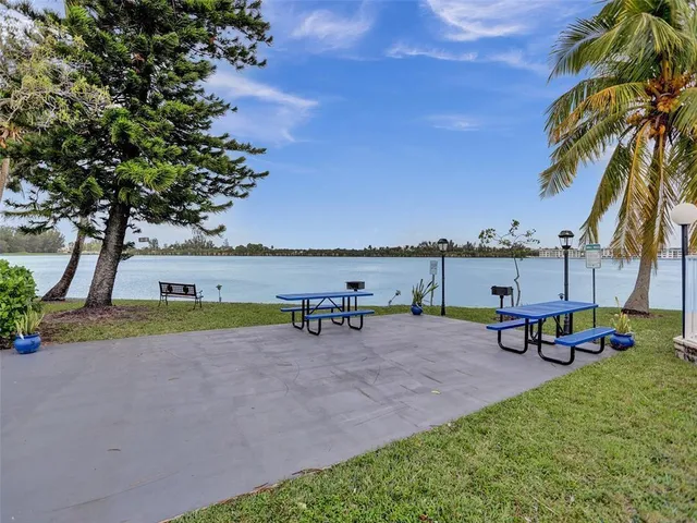 a view of a lake with a city skyline in the background