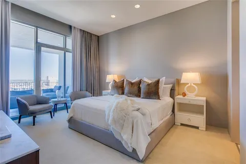 a bedroom with bed and a couch