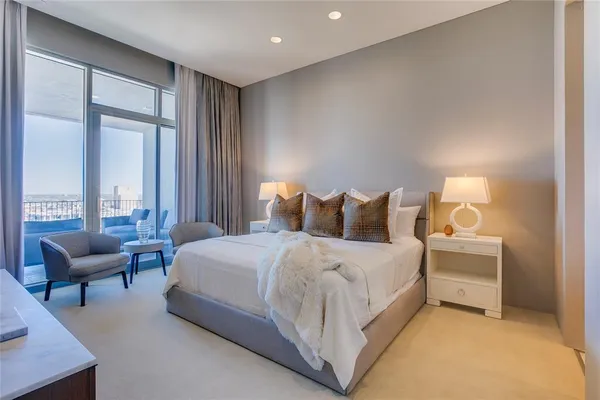 a bedroom with bed and a couch