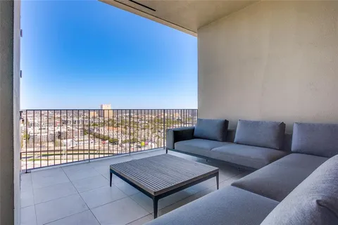 a view of an empty room and a balcony