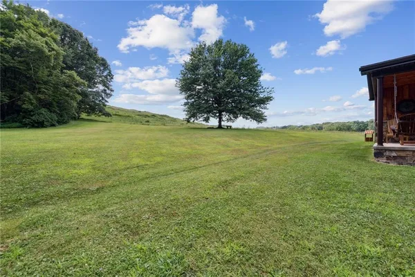 a view of a field with an outdoor space