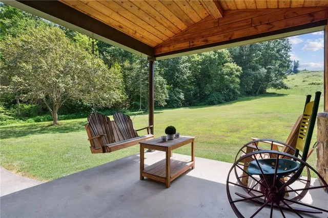 a view of chairs and table in the patio