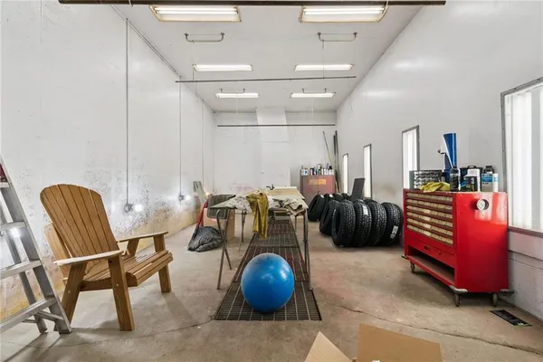 a room with gym equipment and windows
