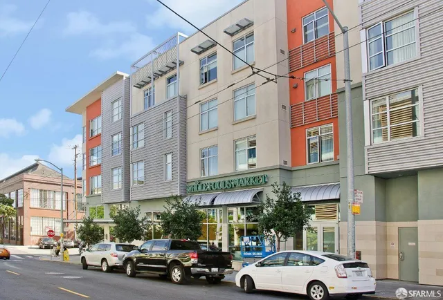 a view of a car parked in front of a building
