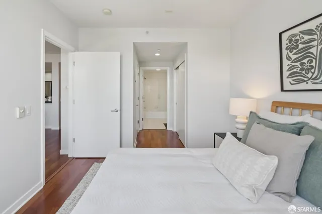 a bedroom with a bed and lamp