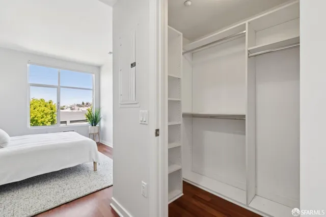 a bedroom with a bed and a closet