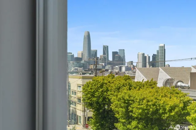 a view of a city with tall buildings