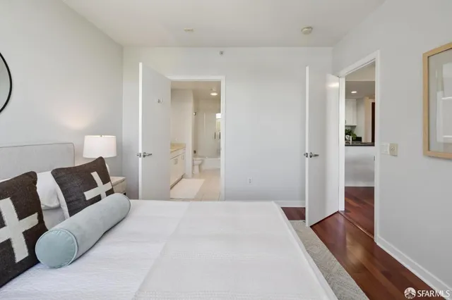 a bedroom with a bed and couch